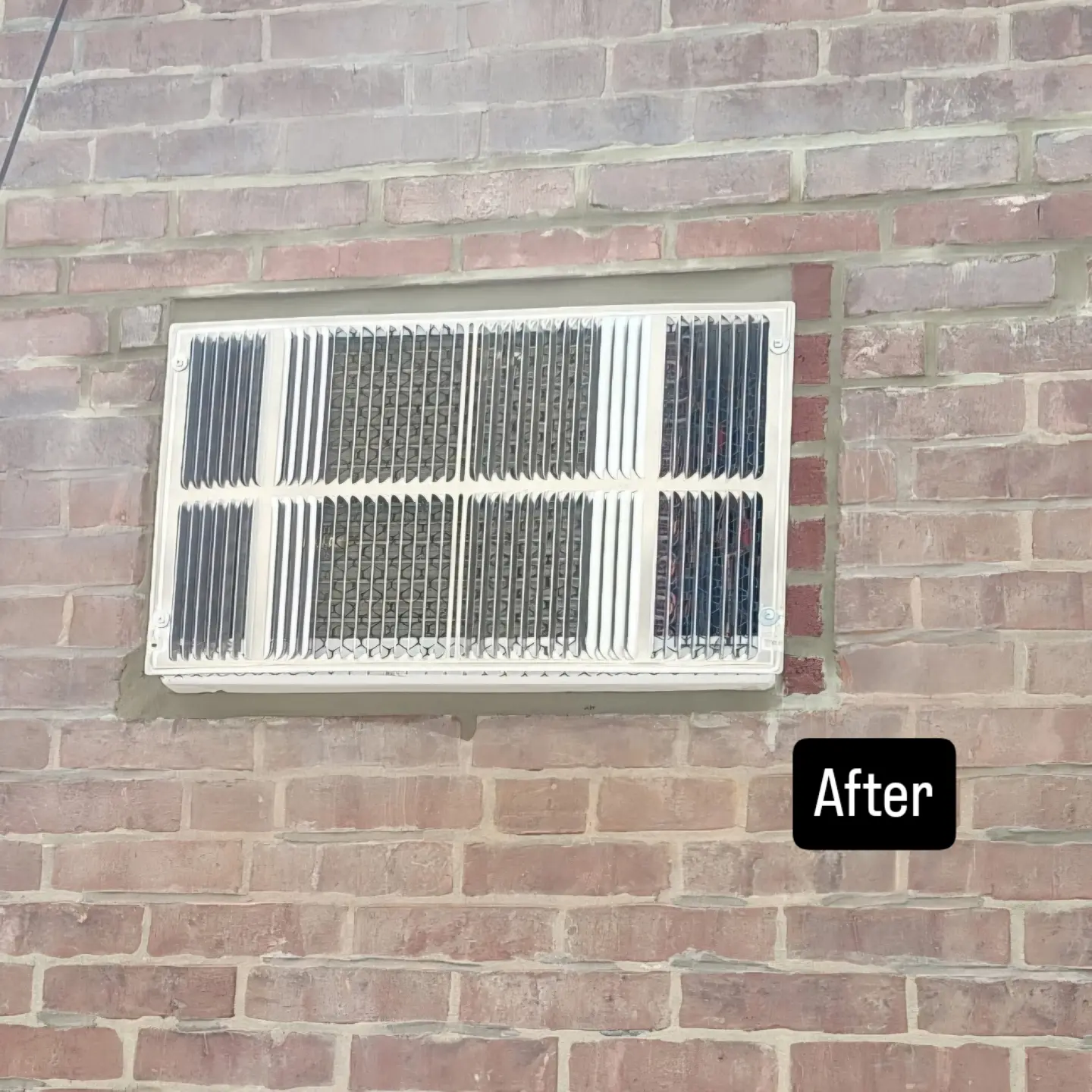 Brick wall repaired and pointed around a new wall vent
