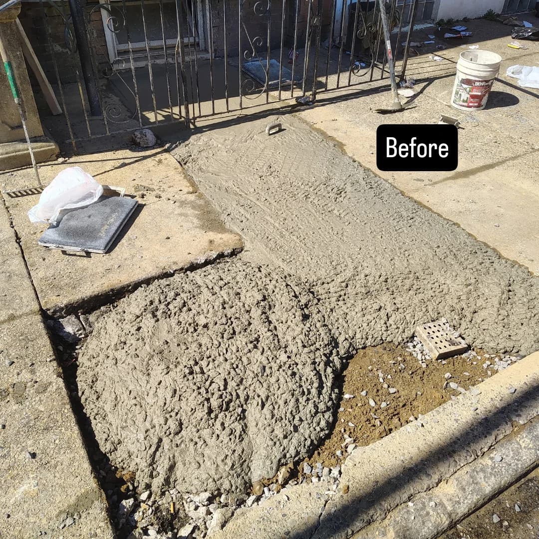 Broken concrete walkway torn out before replacement